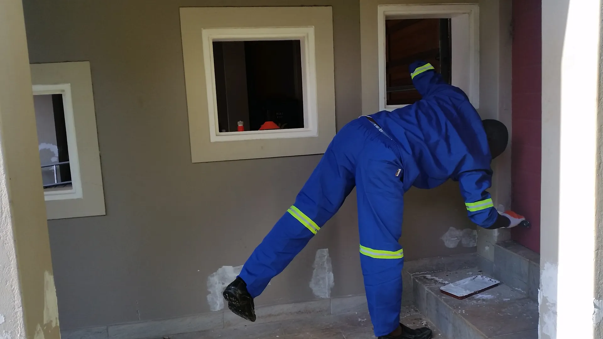 Exterior wall painting in progress (photo 2)